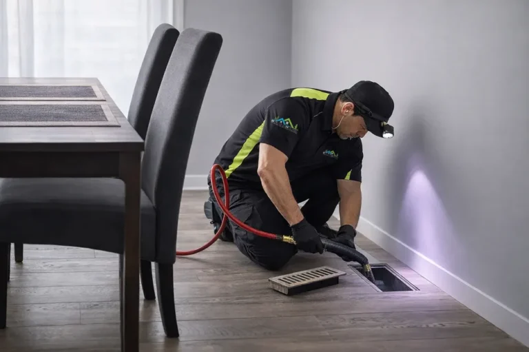 Duct Technician Cleaning Floor Vent